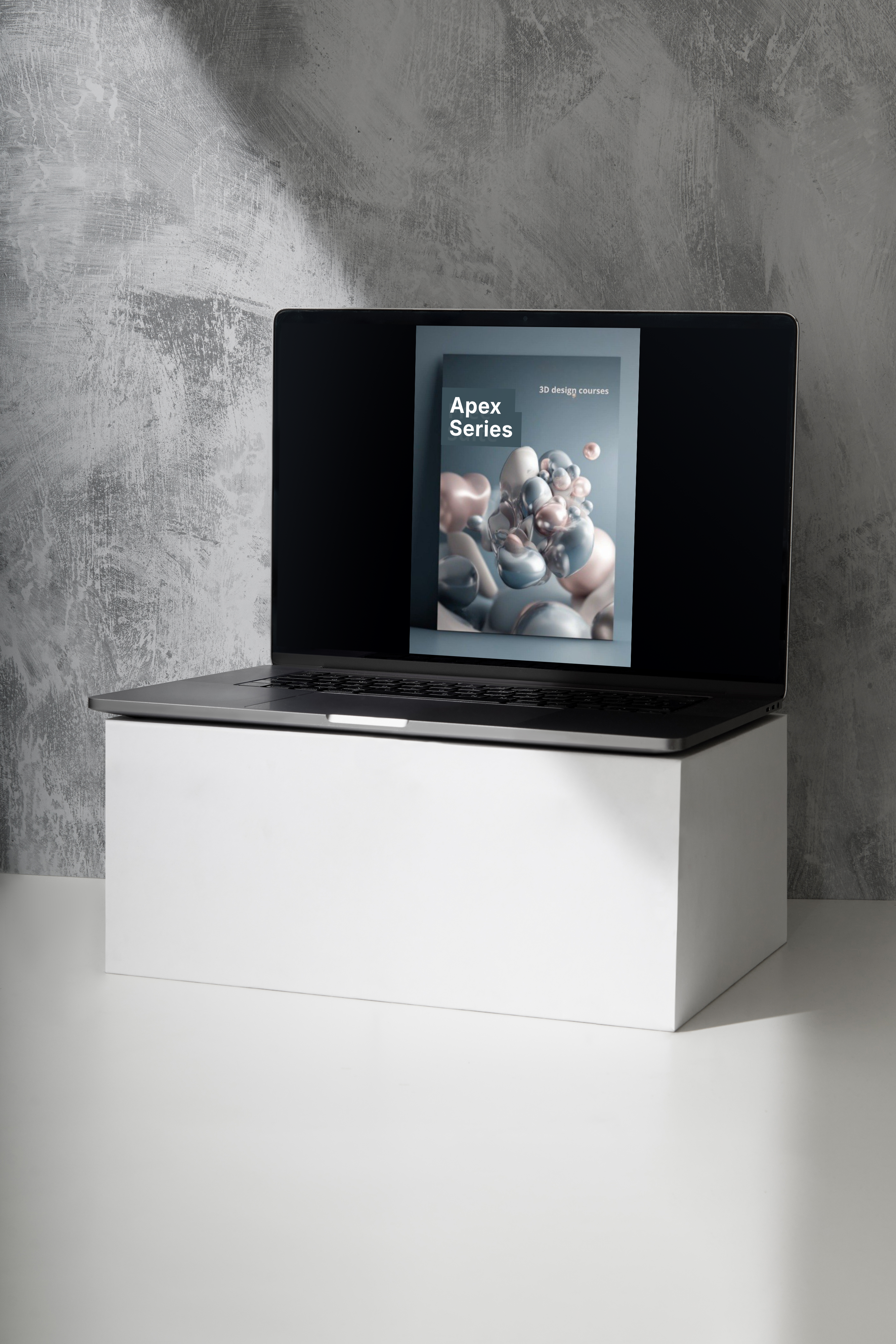 Modern laptop on a white stand against a gray concrete wall
